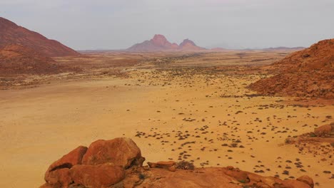 Aerial-over-the-Namib-Desert-and-the-massive-rock-formations-at-Spitzkoppe-Namibia-3