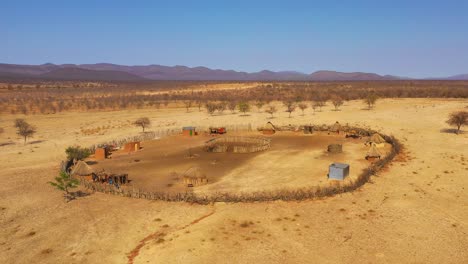 Beautiful-aerial-over-a-round-Himba-African-tribal-settlement-and-family-compound-in-northern-Namibia-Africa-1