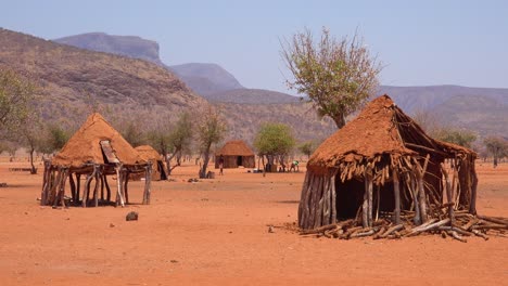 Small-poor-African-Himba-rural-village-on-the-Namibia-Angola-border-with-mud-huts-goats-and-children-1