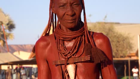Tilt-up-portrait-of-a-Himba-tribal-African-woman-face-with-mud-dreadlocks-hair-and-neck-ring-jewelry