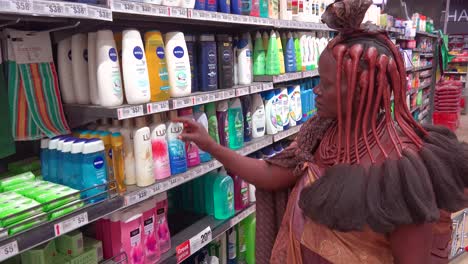 Astonishing-shot-of-tribal-African-Himba-woman-shopping-in-a-modern-supermarket-in-Opuwa-Namibia-contrast-of-old-and-modern-life