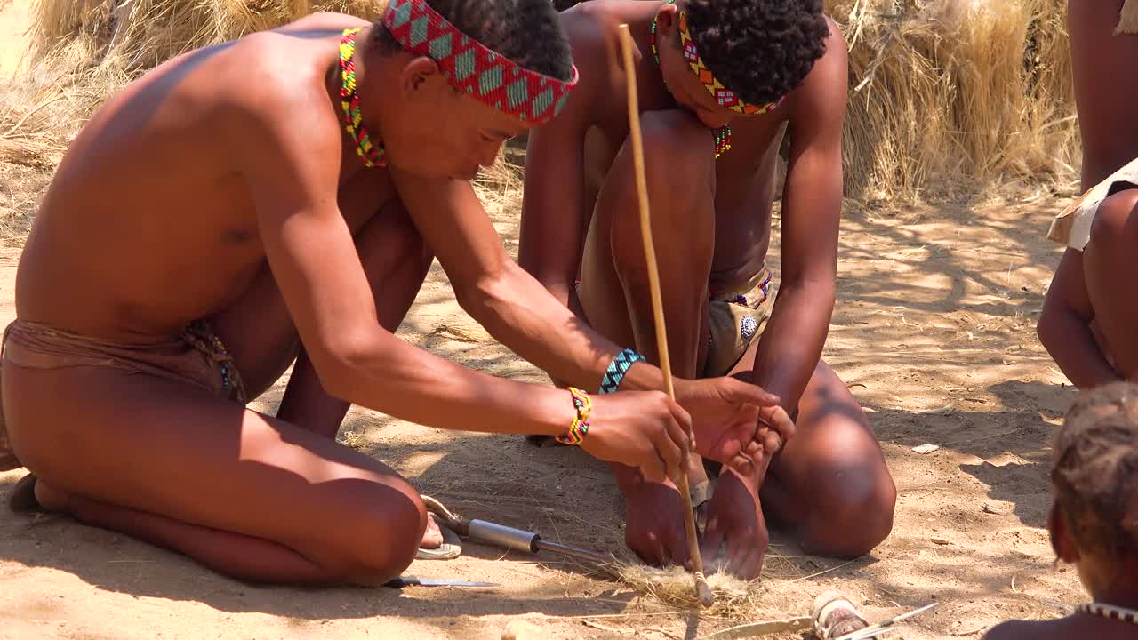 African San Tribal Bushmen Make Fire The Traditional Way In A Small  Primitive Village In Namibia Africa 1 Free Stock Video Footage Download  Clips Culture