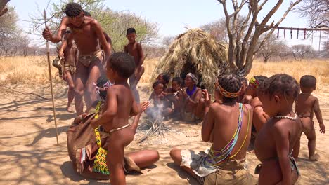 African-San-tribal-bushmen-perform-a-fire-dance-in-a-small-primitive-village-in-Namibia-Africa