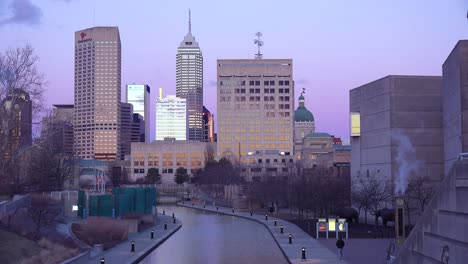 Indianapolis-Indiana-skyline-at-dusk-with-statehouse-capital-building-visible-and-riverwalk