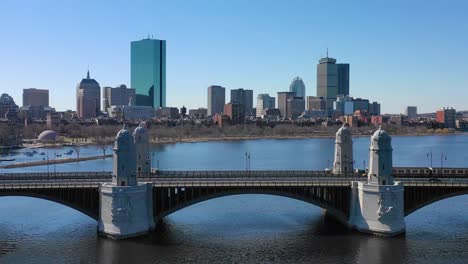 Aerial-establishing-city-skyline-of-Boston-Massachusetts-with-Longfellow-bridge-and-subway-train-crossing-2