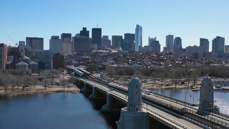 Aerial-establishing-city-skyline-of-Boston-Massachusetts-with-Longfellow-bridge-and-subway-train-crossing-4