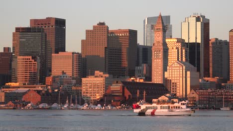 Skyline-of-downtown-Boston-Massachusetts-with-water-taxi-at-sunset-or-sunrise-1