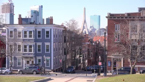 Establishing-shot-of-apartments-and-streets-on-Bunker-Hill-Boston-Massachusetts-with-Leonard-P-Zakim-Bunker-Hill-Memorial-Bridge-background
