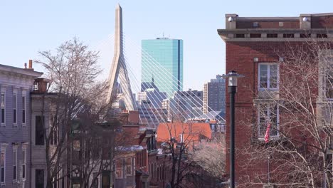 Establishing-shot-of-apartments-and-streets-on-Bunker-Hill-Boston-Massachusetts-with-Leonard-P-Zakim-Bunker-Hill-Memorial-Bridge-background-1