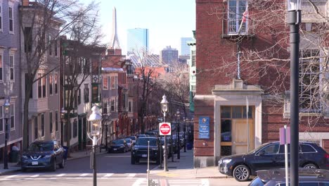 Establishing-shot-of-apartments-and-streets-on-Bunker-Hill-Boston-Massachusetts-with-Leonard-P-Zakim-Bunker-Hill-Memorial-Bridge-background-2
