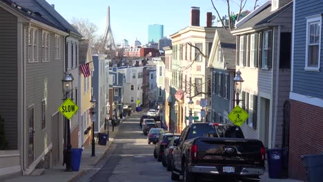 Establishing-shot-of-apartments-and-streets-on-Bunker-Hill-Boston-Massachusetts-with-Leonard-P-Zakim-Bunker-Hill-Memorial-Bridge-background-3