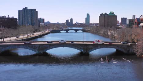Aerial-over-bridges-on-the-Charles-River-near-Harvard-University-campus-with-scullers-crew-rowing-on-the-river-1