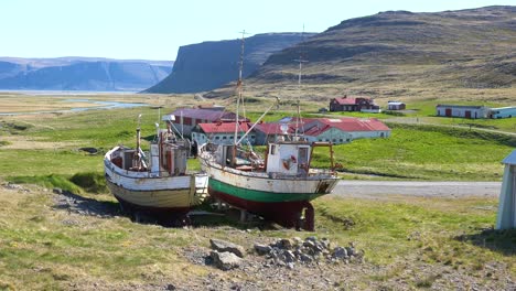 Abandoned-fishing-boats-sit-on-the-land-in-a-remote-fjord-in-Iceland-as-the-cod-industry-declines-1