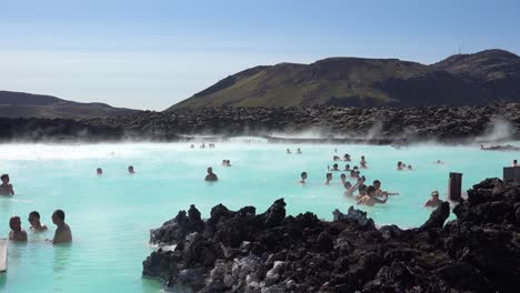 Establishing-of-bathers-enjoying-the-famous-Blue-Lagoon-geothermal-hot-water-spa-and-bath-in-Grindavik-Iceland-2