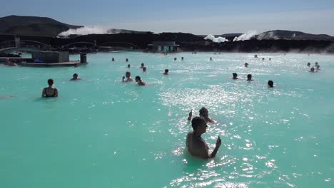 Establishing-of-bathers-enjoying-the-famous-Blue-Lagoon-geothermal-hot-water-spa-and-bath-in-Grindavik-Iceland-3