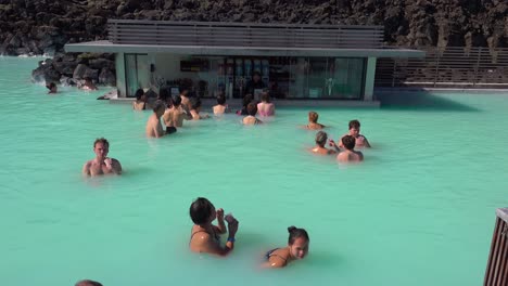 Establishing-of-bathers-enjoying-the-famous-Blue-Lagoon-geothermal-hot-water-spa-and-bath-in-Grindavik-Iceland-4