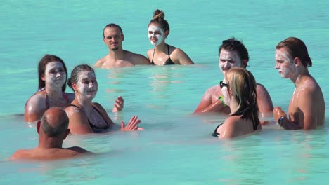 Establishing-of-bathers-with-mud-facials-in-the-famous-Blue-Lagoon-geothermal-hot-water-spa-and-bath-in-Grindavik-Iceland