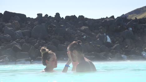 Establishing-of-bathers-with-mud-facials-in-the-famous-Blue-Lagoon-geothermal-hot-water-spa-and-bath-in-Grindavik-Iceland-1