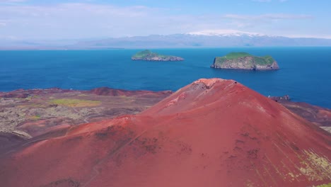 Good-aerial-of-Eldfell-volcano-looming-over-Heimaey-in-the-Westman-Islands-Vestmannaeyjar-Iceland--4