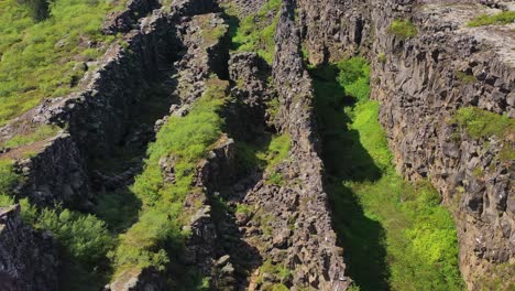 Tilt-up-aerial-over-the-mid-Atlantic-Ridge-tectonic-plate-at-Thingvellir-Iceland-1