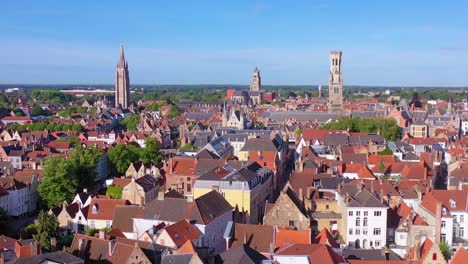Pretty-establishing-aerial-of-the-skyline-of-Bruges-Belgium-includes-Belfort-Van-Brugge-and-other-landmarks