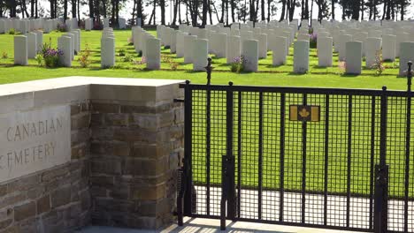 Graves-and-crosses-at-Calais-Canadian-World-War-Two-cemetery-memorial-near-Omaha-Beach-Normandy-France