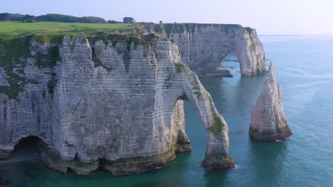 Nice-aerial-around-white-limestone-cliffs-and-arches-at-Etretat-France-English-Channel-3