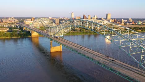 Excellent-rising-aerial-over-the-Hernando-de-Soto-Bridge-reveals-the-city-skyline-and-business-district-of-Memphis-Tennessee