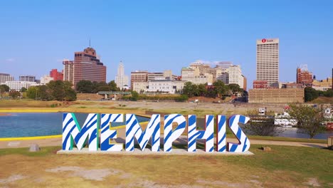 Aerial-over-Memphis-sign-on-Mud-Island-looking-towards-Memphis-Tennessee-downtown-skyline-1