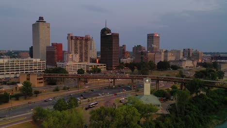 Night-or-dusk-aerial-shot-approaching-the-downtown-business-district-of-Memphis-Tennessee