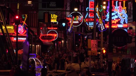 Establishing-night-and-crowds-on-Beale-Street-Memphis-Tennessee-with-neon-signs-bars-and-clubs-1