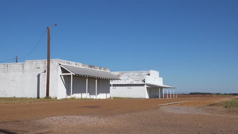 An-old-abandoned-building-stands-in-a-dusty-and-run-down-small-town-in-Mississippi-America-2