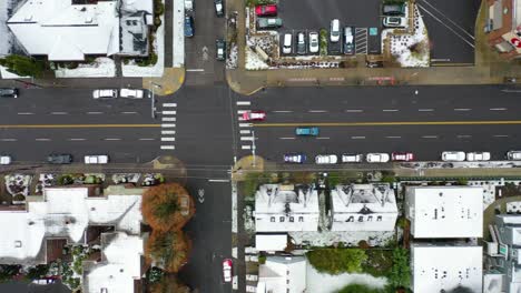 Top-down-aerial-over-snowy-streets-and-cars-in-suburbs-in-snow-in-Portland-Oregon