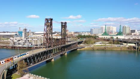 Aerial-over-steel-Bridge-Portland-Oregon-with-rapid-transit-over-Willamette-River-1