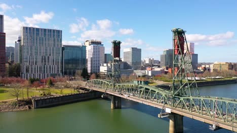 Aerial-through-Hawthorne-Bridge-in-Portland-Oregon-over-Willamette-River-reveals-downtown-business-district