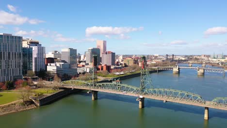 Aerial-through-Hawthorne-Bridge-in-Portland-Oregon-over-Willamette-River-reveals-downtown-business-district-1