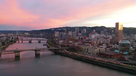 Very-good-dusk-aerial-of-downtown-Portland-Oregon-Willamette-River-skyline-stag-sign-bridges-and-old-town