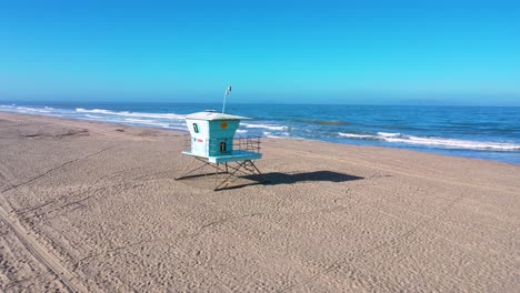 2020---aerial-of-closed-lifeguard-station-and-abandoned-beaches-of-southern-california-during-covid-19-coronavirus-epidemic-as-people-stay-home-en-masse