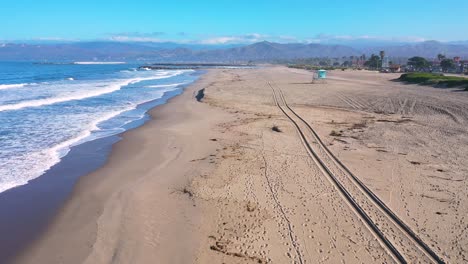 2020---aerial-of-closed-lifeguard-station-and-abandoned-beaches-of-Ventura-southern-california-during-covid-19-coronavirus-epidemic-as-people-stay-home-en-masse-1