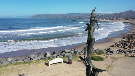 2020---aerial-of-mermaid-statue-and-abandoned-beaches-of-Ventura-southern-california-during-covid-19-coronavirus-epidemic-as-people-stay-home-en-masse-2