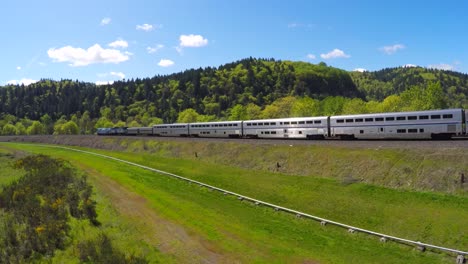 An-aerial-view-following-an-Amtrak-passenger-train