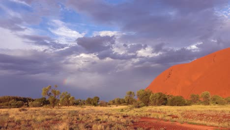 A-rainbow-forms-during-a-storm-near-Ayers-Rock-Uluru-in-the-outback-of-Australia-1