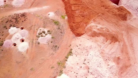 Aerial-drone-shot-of-opal-mines-and-mining-tailings-in-the-desert-outback-of-Coober-Pedy-Australia-3