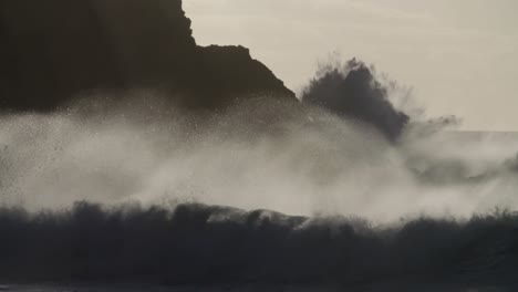 Blue-waves-roll-into-the-coast-of-Hawaii-and-crash-into-the-shore-in-slow-motion-during-a-big-storm-1
