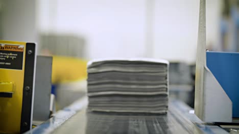 Newspapers-are-stacked-and-processed-in-a-newspaper-factory-1
