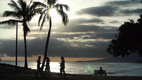 Scenic-with-walkers-and-jogger-at-Ala-Moana-Beach-Park-in-Honolulu-Hawaii