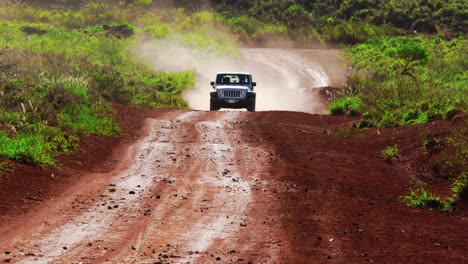 A-silver-Jeep-drives-along-a-red-dirt-road-on-the-island-of-Lanai-in-Hawaii-6