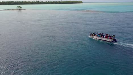 A-ferry-of-refugees-or-residents-travels-across-the-Tabuaeran-Lagoon-on-the-Pacific-Island-of-Kiribati