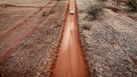 Aerial-over-a-pickup-truck-driving-on-a-dirt-road-on-Molokai-Hawaii-from-Maunaloa-to-Hale-o-Lono