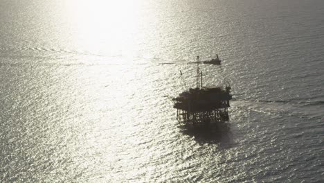 A-beautiful-aerial-shot-over-a-boat-heading-out-to-oil-derricks-and-platforms-in-the-Santa-Barbara-Channel-California-1